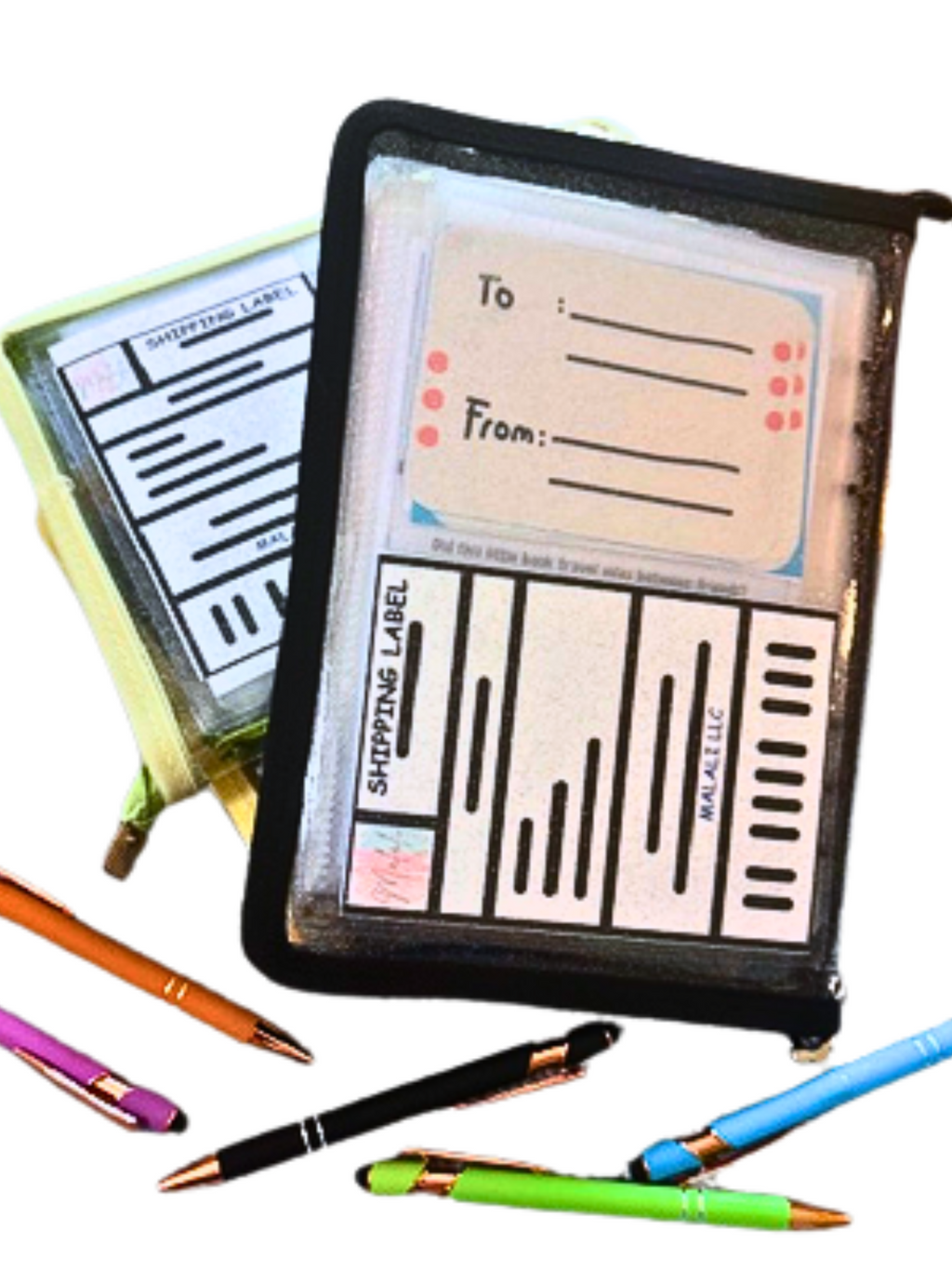 Pen Pal Book with shipping label on back cover and colorful pens on a white background